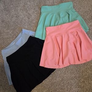 Old Navy Girl's Skort's in Coral, Mint, Black, and Light Blue.